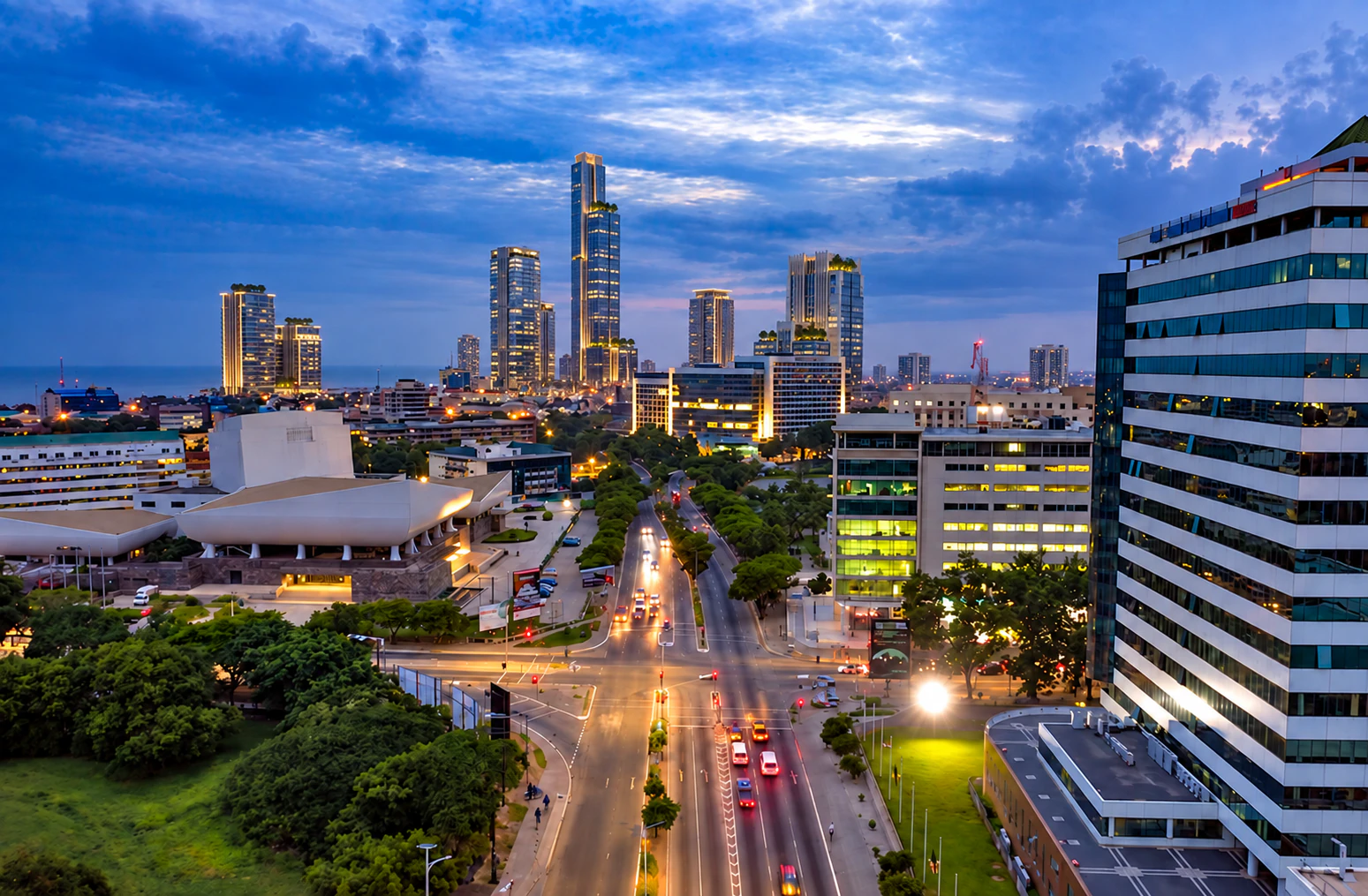A modern city and roadway illuminated in the evening