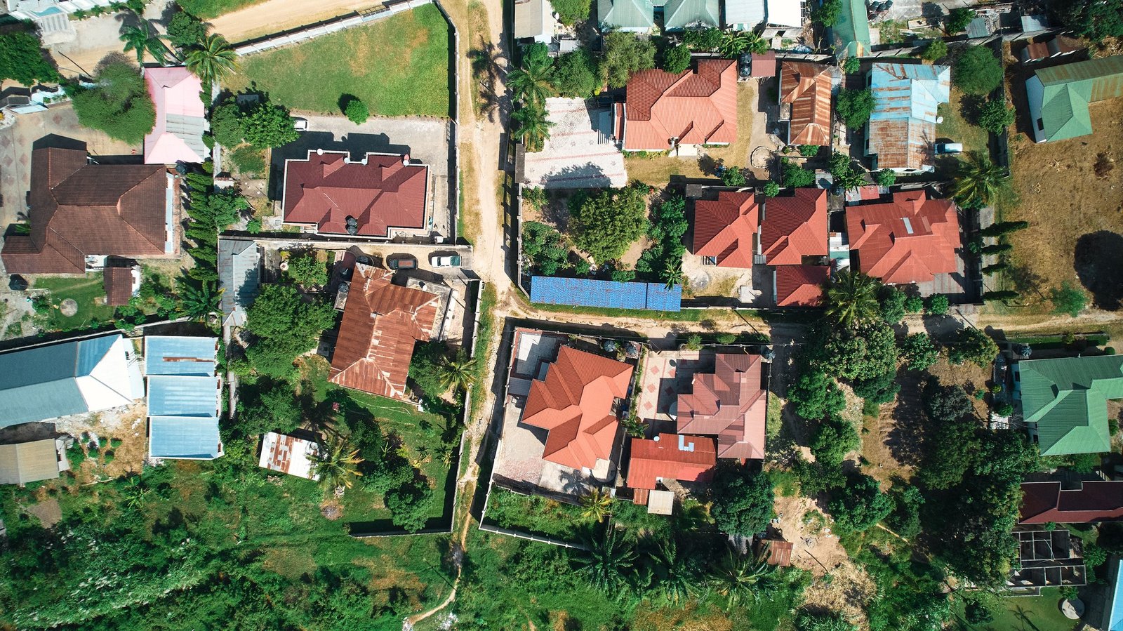 Aerial view of a residential neighbourhood with homes and tree-lined streets